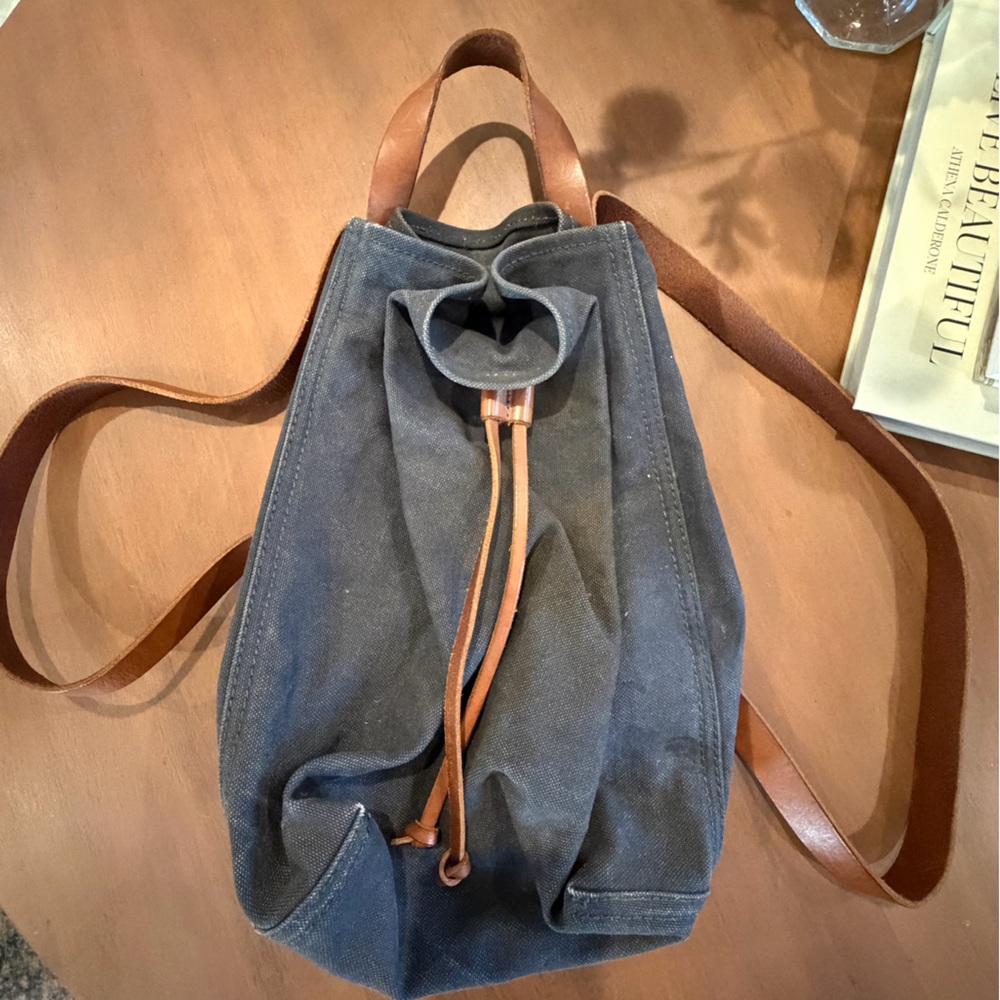 Stylish Blue Canvas Backpack with Brown Straps